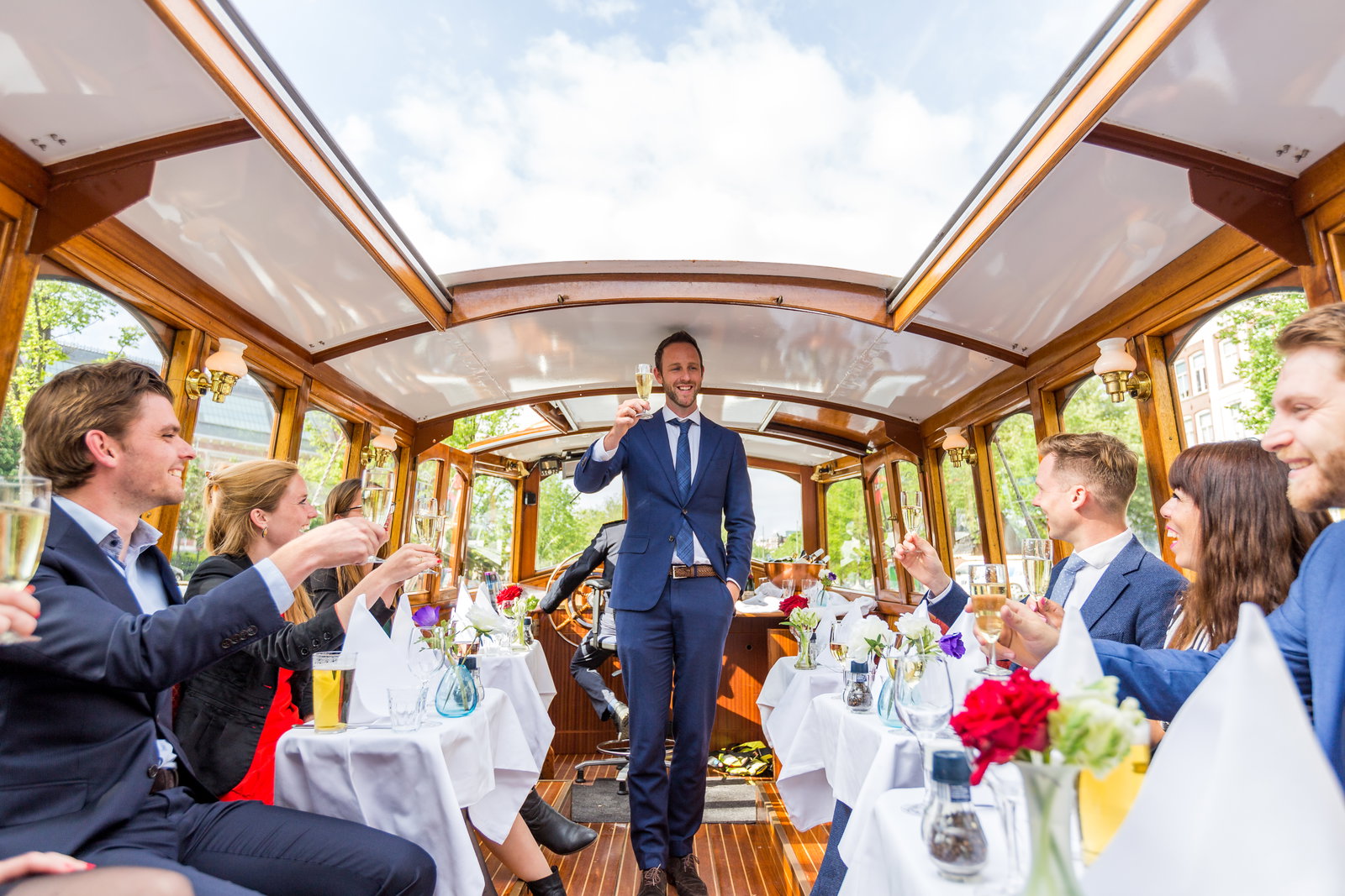 How much does a canal cruise with food cost in Amsterdam?