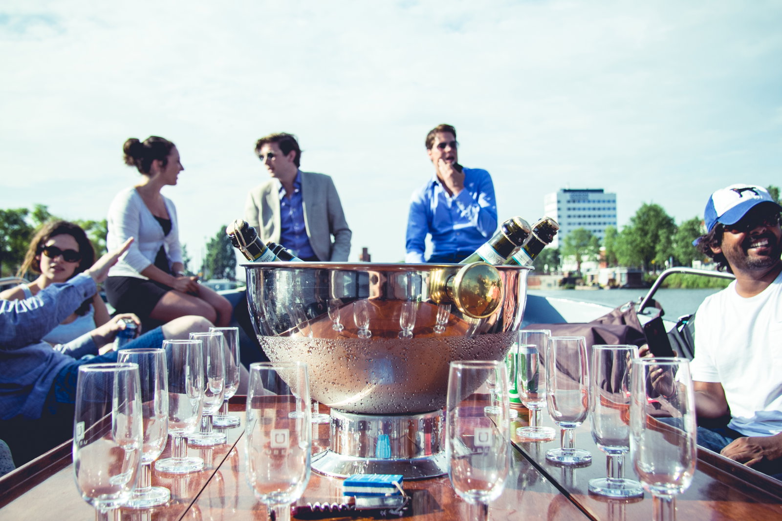 How much does it cost to rent a canal boat in Amsterdam for a corporate event?